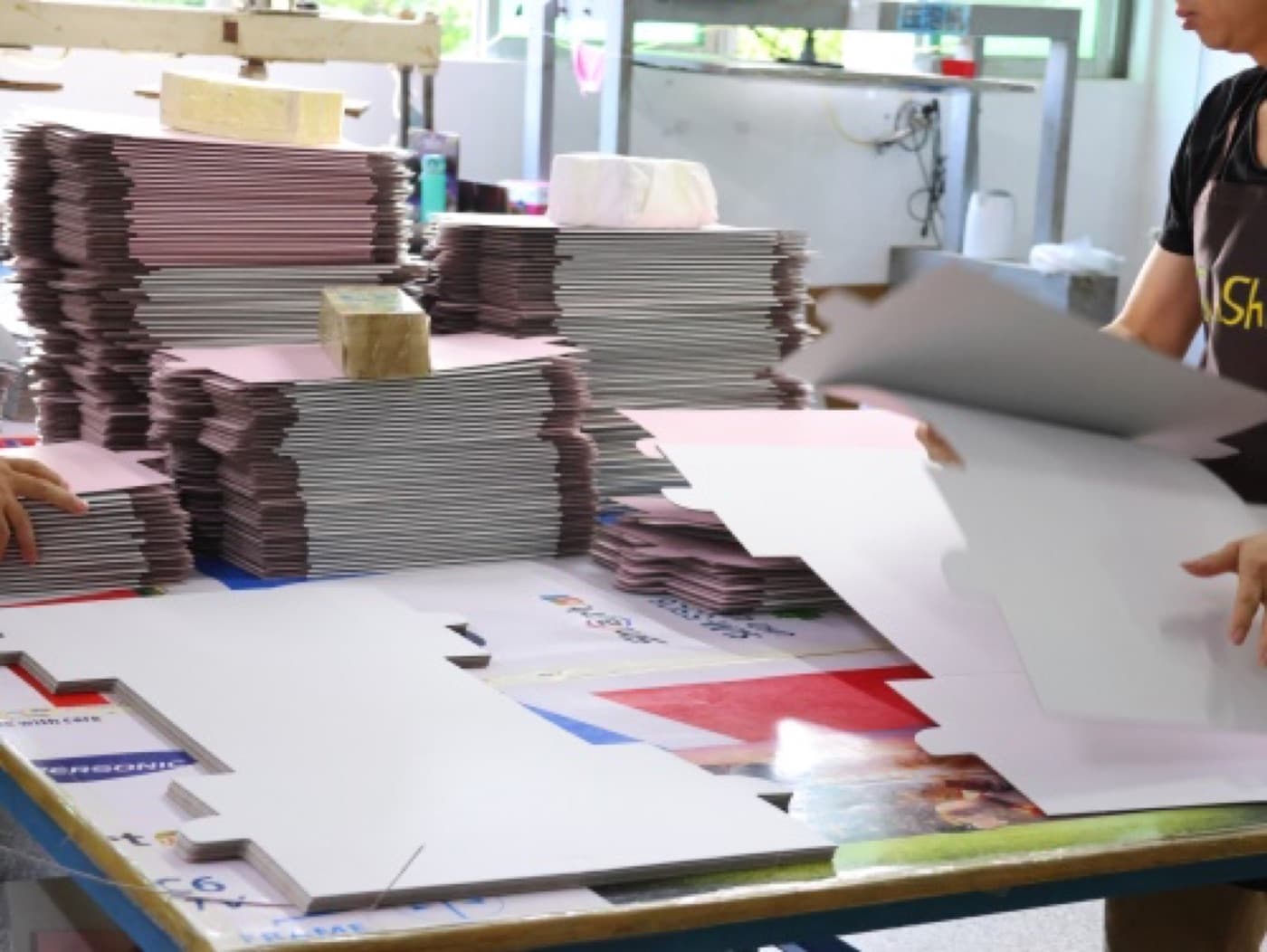 AI-generated representative visual of specialty paper sheets with varied finishes