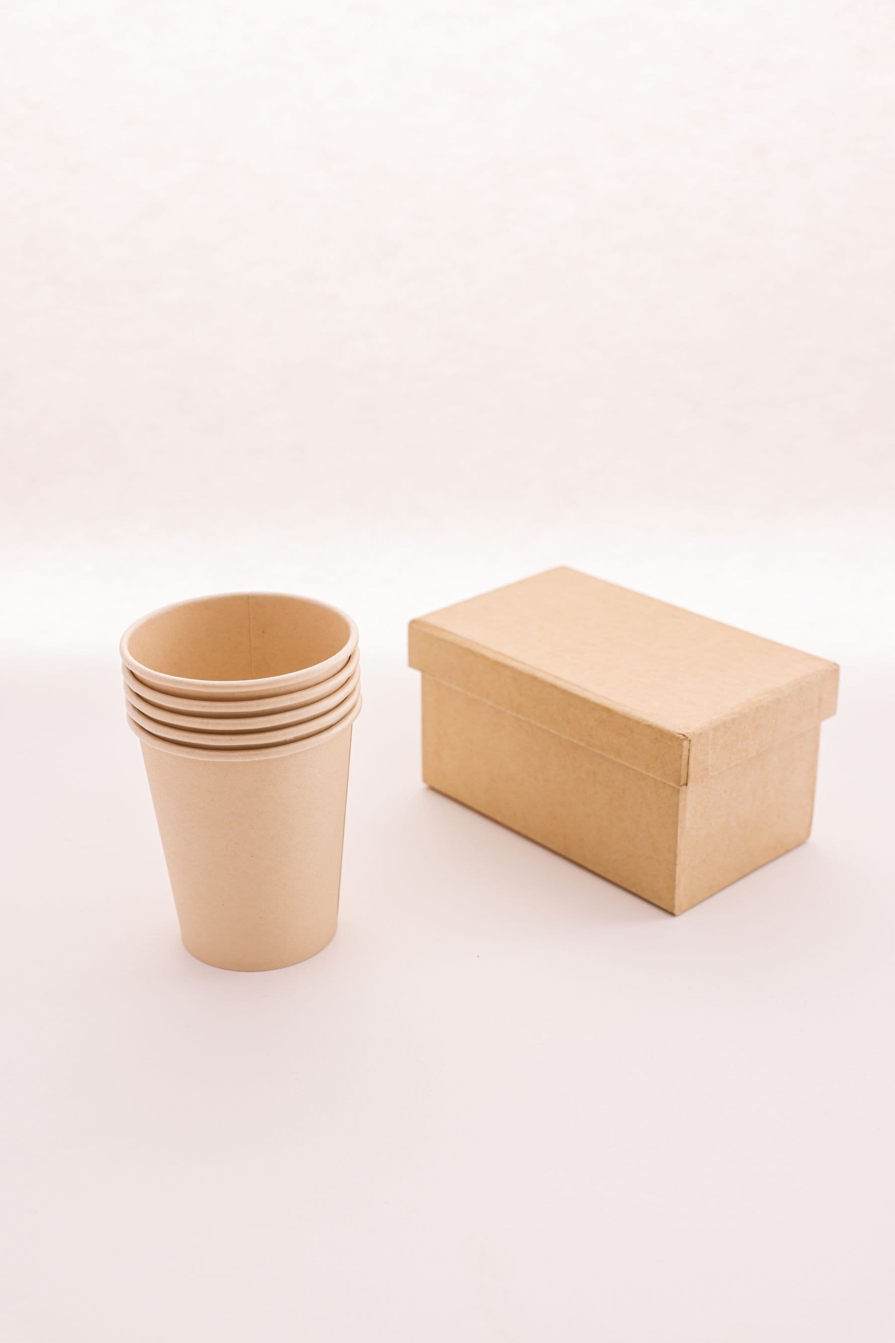 AI-generated representative visual of paper cup fan blanks and coated cupstock pieces