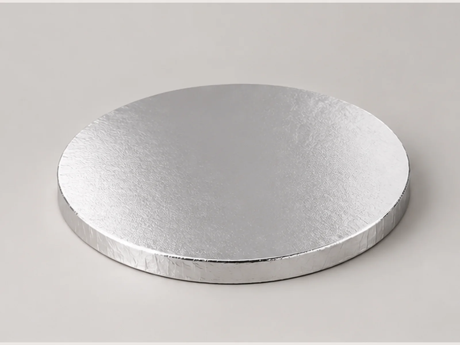 Silver round cake board with wrapped edge