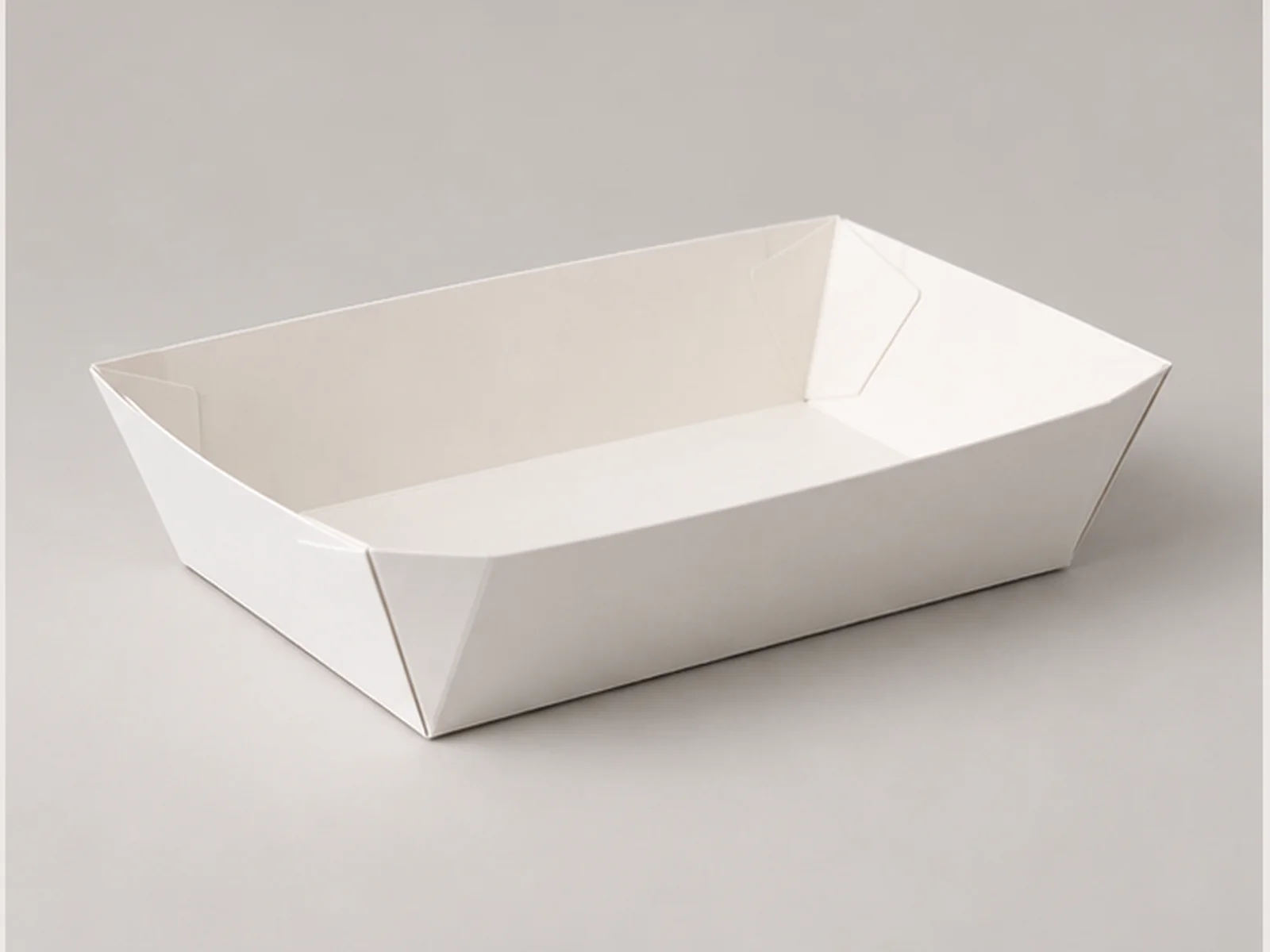 Paper food tray with folded corners